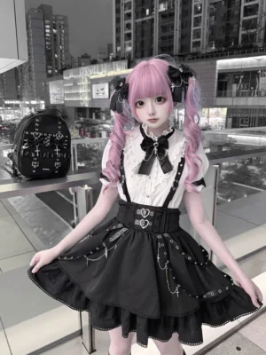 gothic jirai kei suspender skirt and stand collar blouse set front flat lay view with heart buckles and chain details