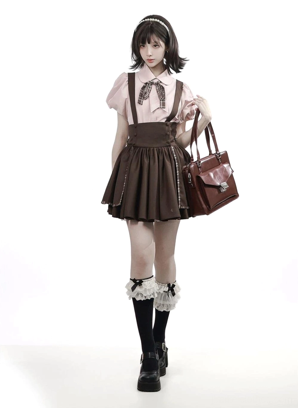 Jirai kei suspender skirt plaid trim hem detail close-up showing layered vintage-inspired design high-waist construction