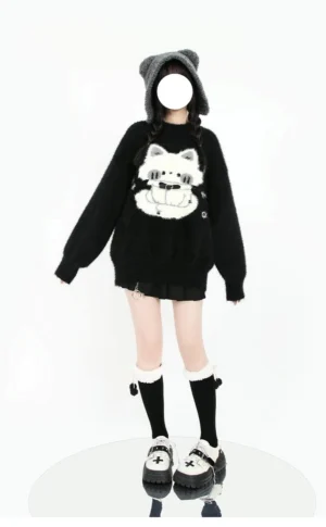 Black oversized Jirai Kei sweater with white cute kitten print on chest, full-body front standing view on model with studio background, plush fuzzy fabric