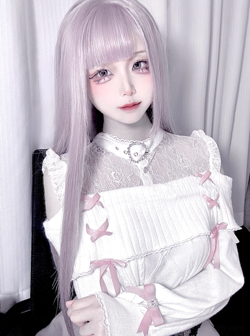 Jirai Kei lace knit sweater detailed view of bow ribbon accents on sleeves and lace overlay construction technique