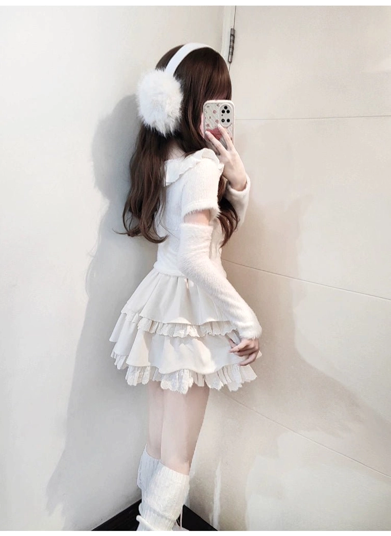 Ivory Jirai Kei sweater skirt set with detachable pearl bow ornament displayed close-up showing fuzzy knit quality and delicate bow chain attachment, white and cream color palette