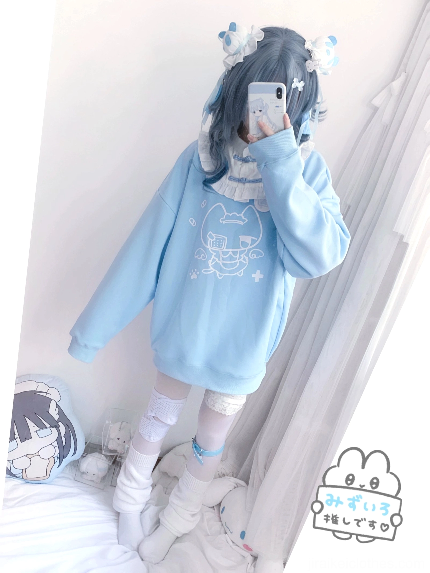 Side mirror selfie of light blue cat print Jirai Kei sweatshirt highlighting wing embroidery detail on back and white ruffled detachable collar design