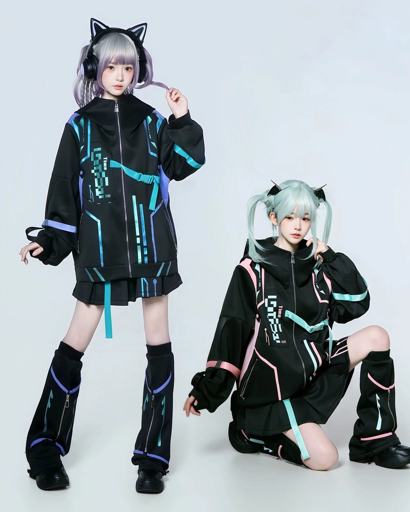 Jirai Kei techwear complete set including jacket, pleated skort, and included striped leg warmers, modeled in standing and seated poses with pastel purple and mint hair