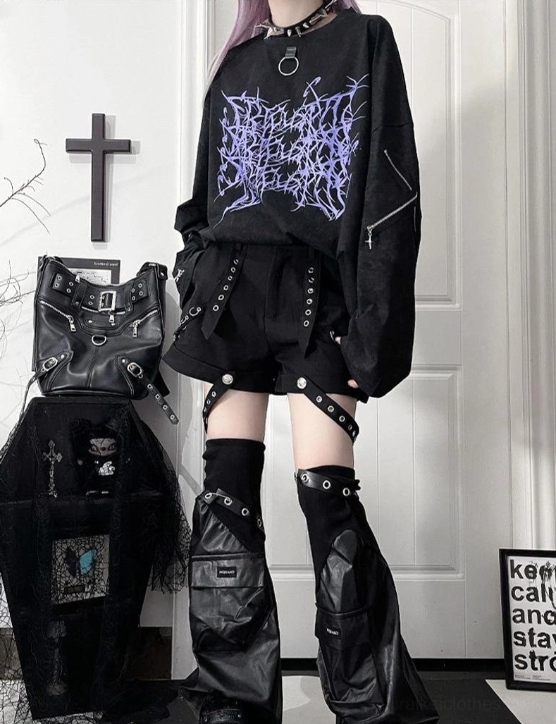 Fabric quality and print durability detail shot of jirai kei oversized long-sleeve t-shirt showing ink application, cotton material weave, and thorn cross design clarity