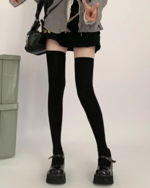 Jirai Kei thigh-high black socks front full lower-body view with gray coat and black mini skirt on model wearing platform Mary Jane shoes