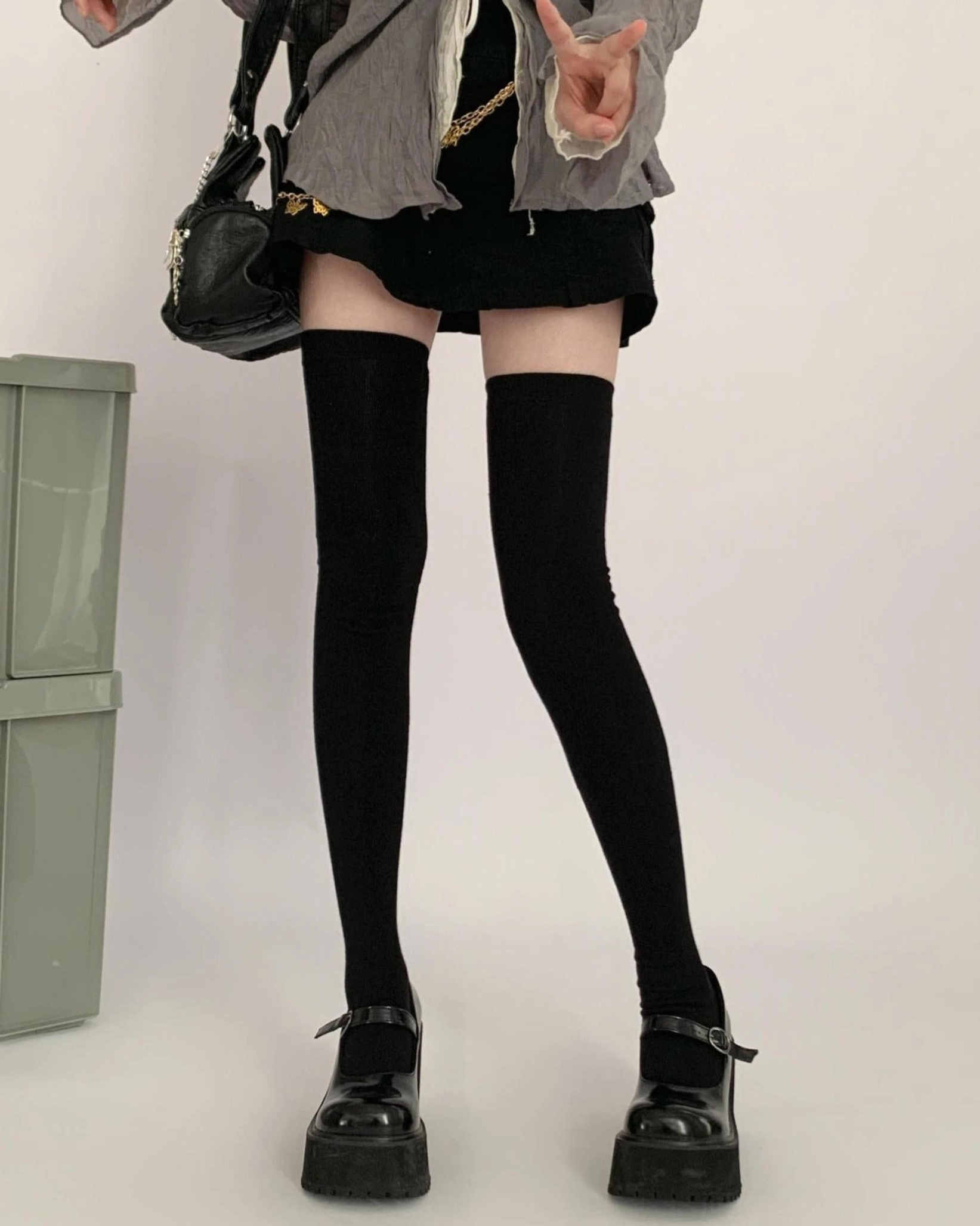 Jirai Kei thigh-high black socks front full lower-body view with gray coat and black mini skirt on model wearing platform Mary Jane shoes