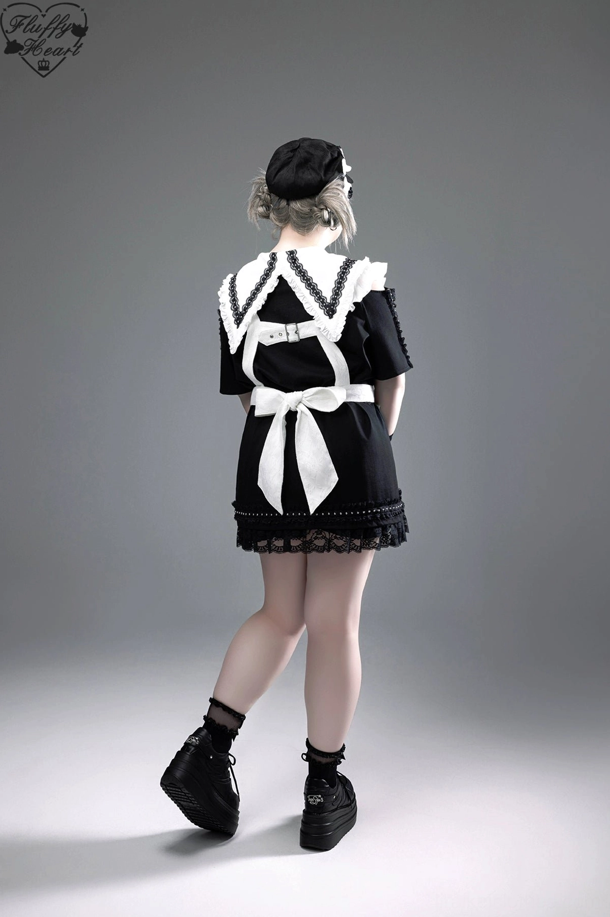 Jirai Kei dress styled with combat boots leather jacket and occult-inspired jewelry completing dark alternative aesthetic