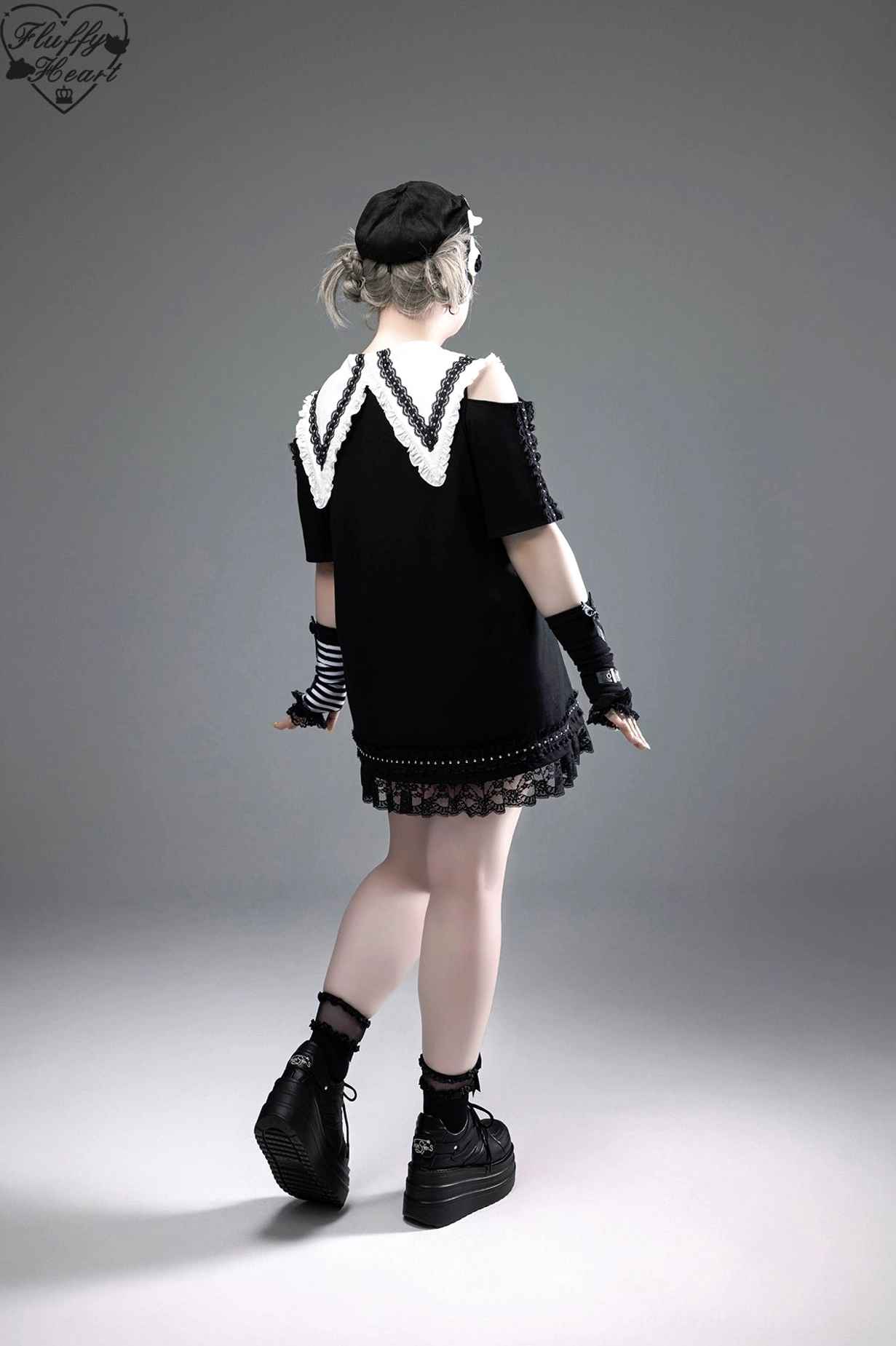 Jirai Kei T-shirt dress worn to gothic subculture gathering with dramatic eye makeup dark lipstick and statement accessories