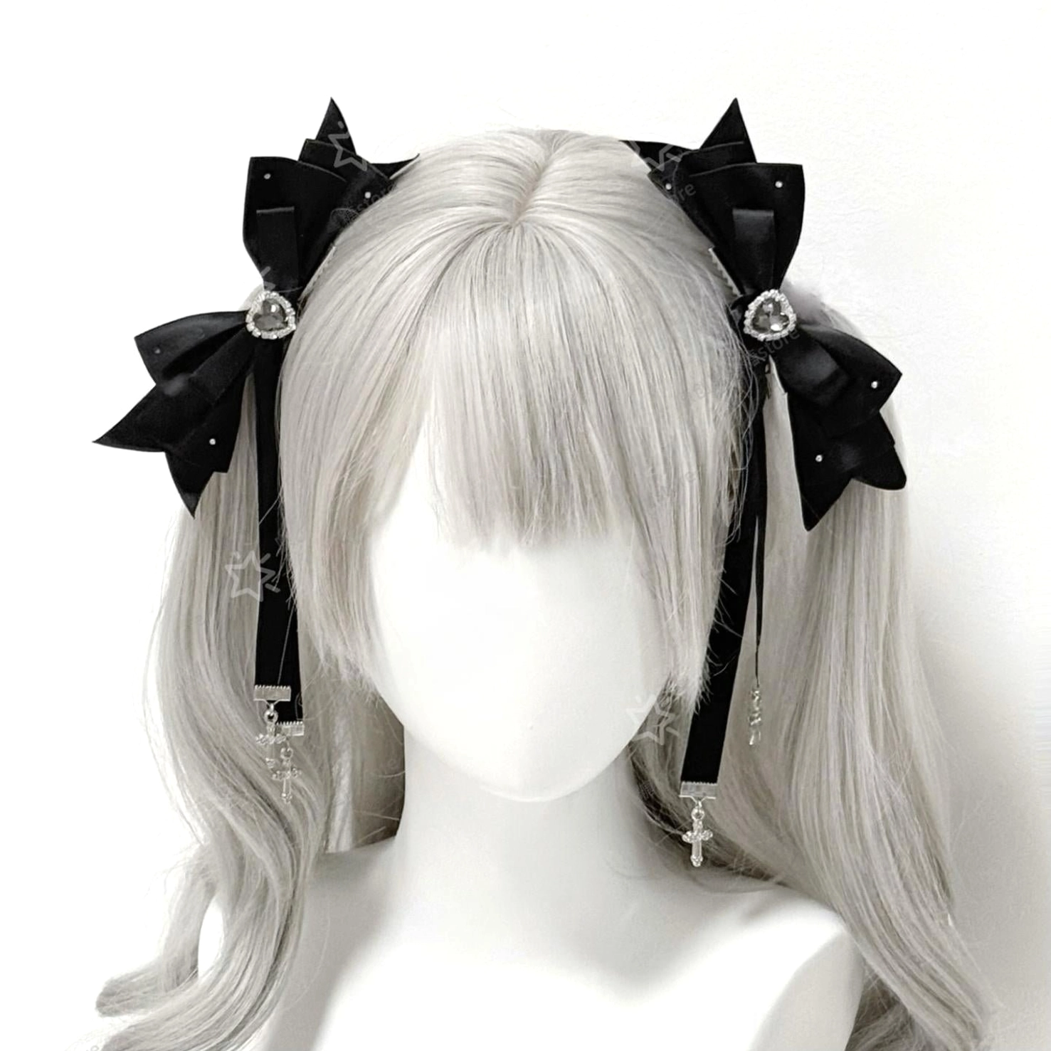 Twin tail cross bow hair clips with heart rhinestones and cross-shaped dangling pendants displayed on mannequin grey wig white background product view