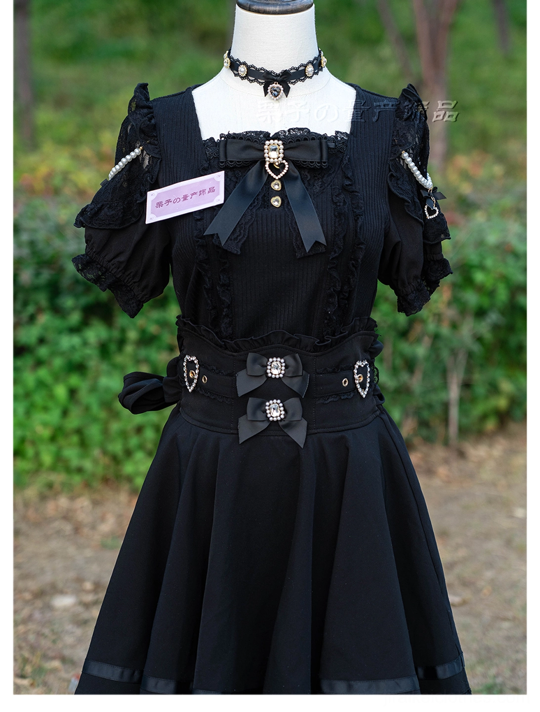 Jirai Kei two-tone lace satin choker necklace with black lace pink bow and heart rhinestone pendant close-up