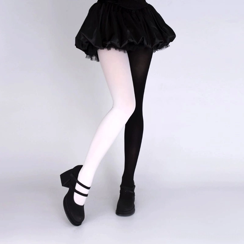 Side leg view of tight velvet pantyhose natural fitting black ruffle skirt platform shoes styling