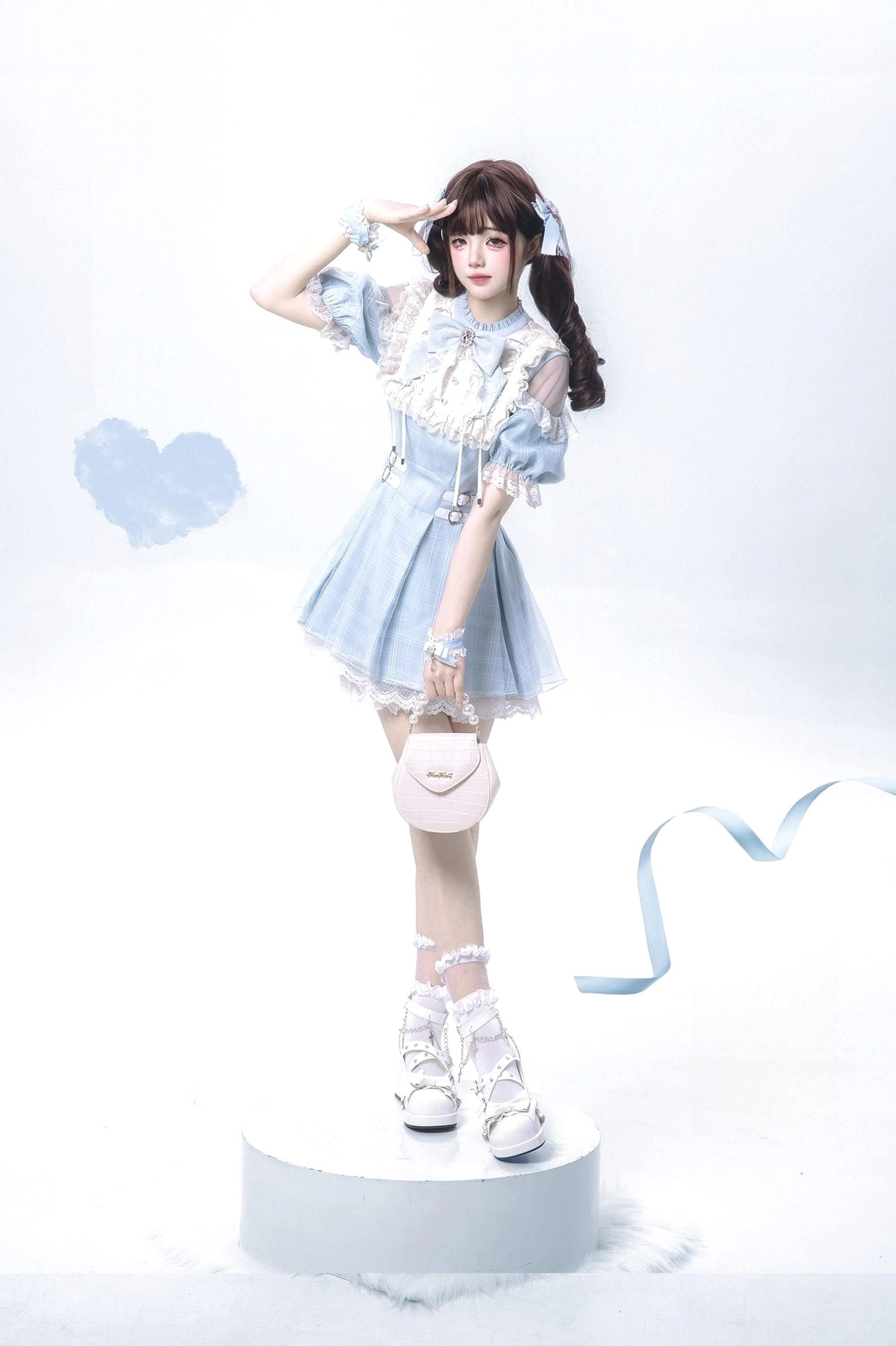 Water blue Jirai Kei dress front three-quarter view on display platform holding pink heart handbag with matching white lace wrist cuffs and delicate accessories