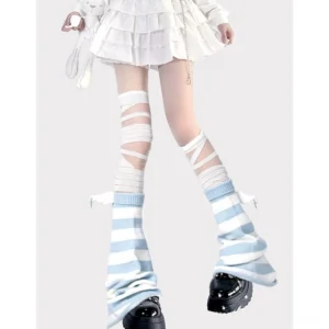 White and blue striped leg warmers with wing charms paired with strap pantyhose, styled with white ruffled skirt on model - complete Jirai Kei Y2K leg warmer set