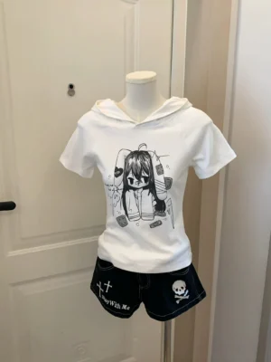 White jirai-kei bunny ear hooded t-shirt with angelic anime wings graphic print, front view on mannequin with printed black shorts, indoor styling