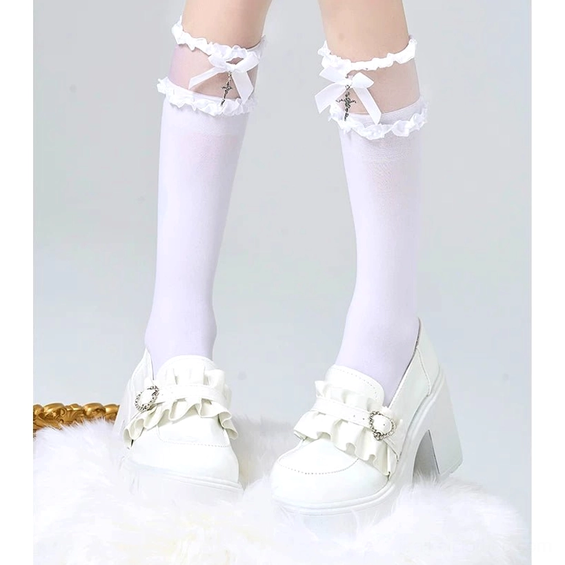 White calf-length Jirai Kei lolita socks with delicate lace ruffled cuff, white bow and cross pendant paired with white platform loafers