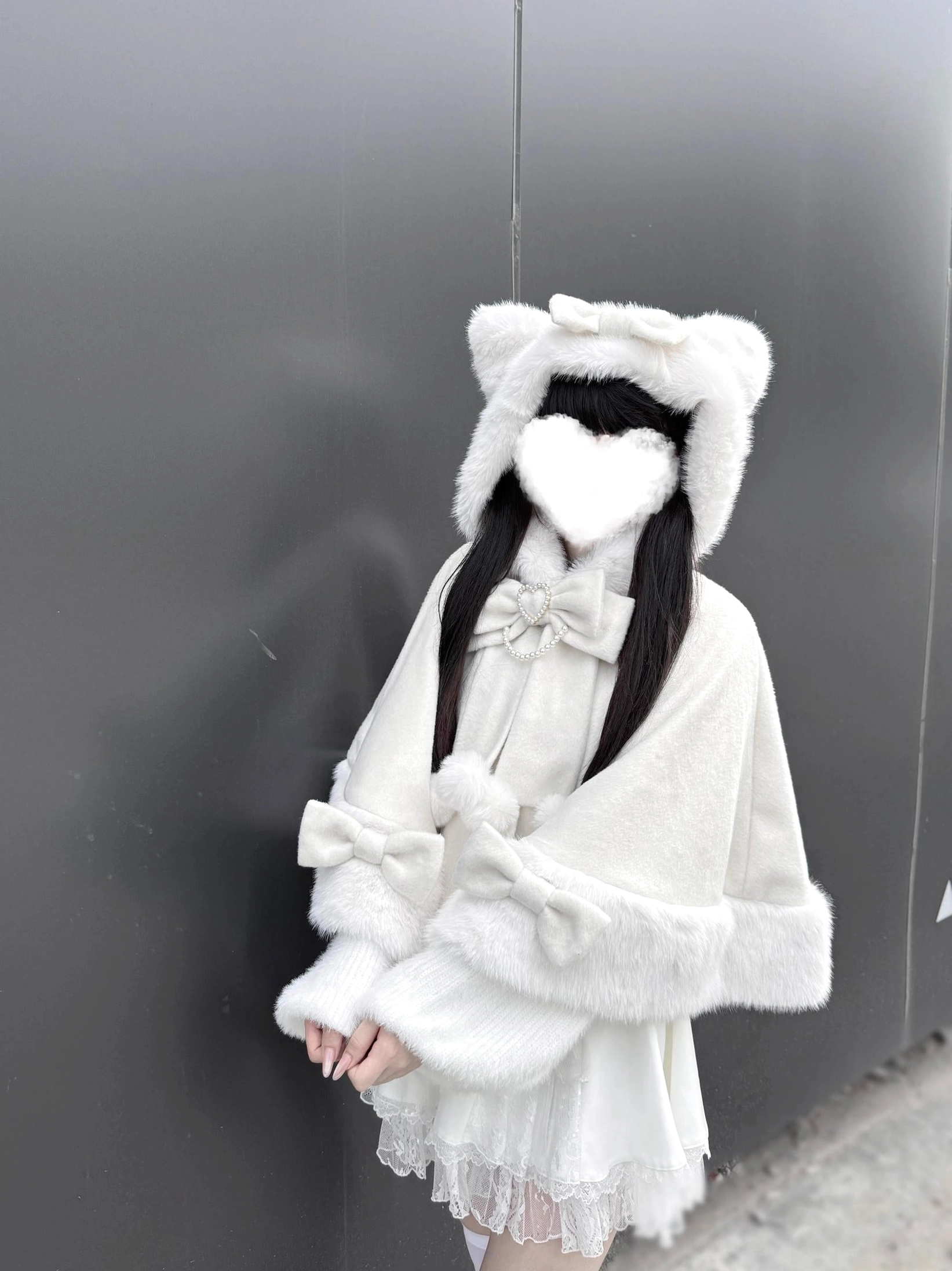 Jirai Kei white cat ear hooded plush cape side view showing double heart bow decoration and fluffy trim details