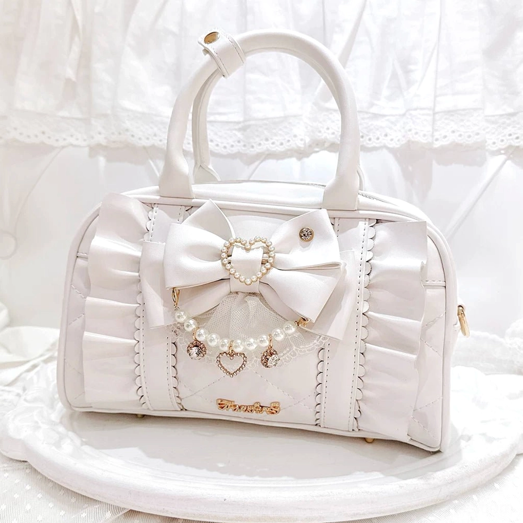 Cream white off-white Jirai Kei handbag with ruched trim details and bow with heart pearl charm, elegant flat lay photography