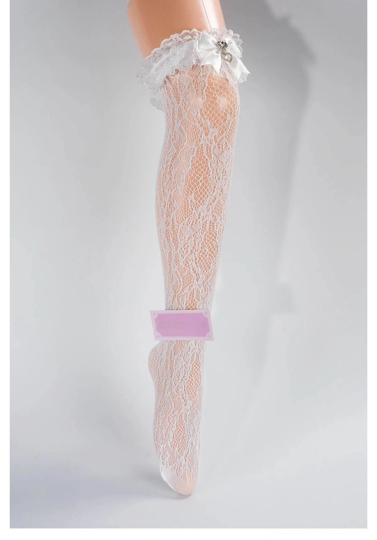 White lace mid-calf Jirai Kei socks with delicate ruffled lace cuff detail, solid off-white floral lace texture, front partial close-up view
