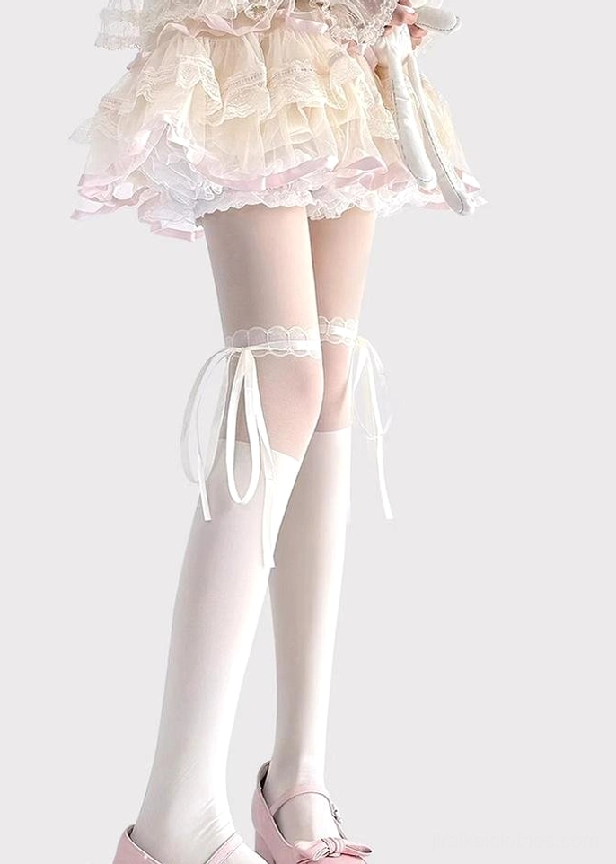 White lace thigh-high Jirai Kei socks back left angle outer thigh ribbon bows sheer silk material