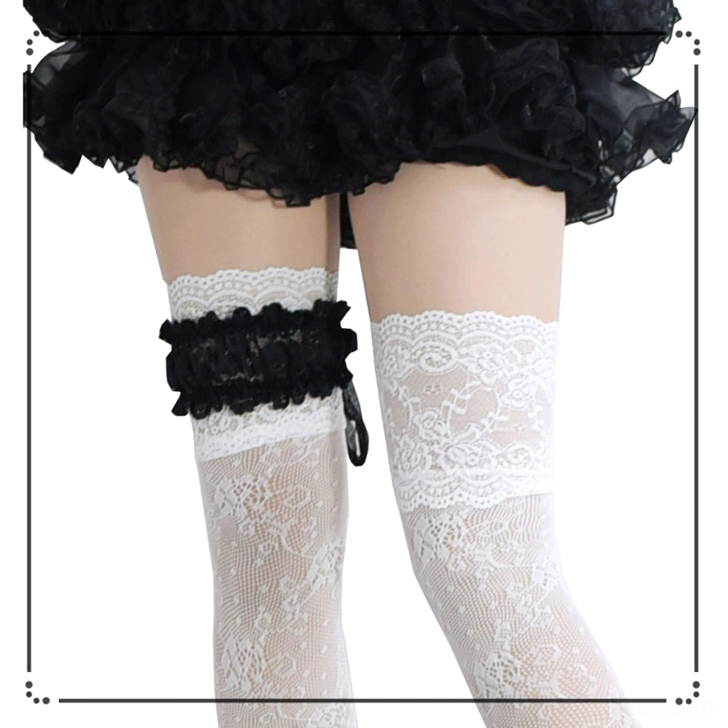 White lace Jirai Kei stockings back partial view with black ruffled top cuff, Gothic Lolita aesthetic over-the-knee design