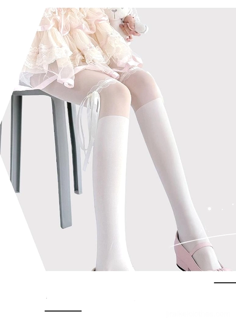 White lace thigh-high Jirai Kei stockings seated right side view ribbon bow sheer silk fabric