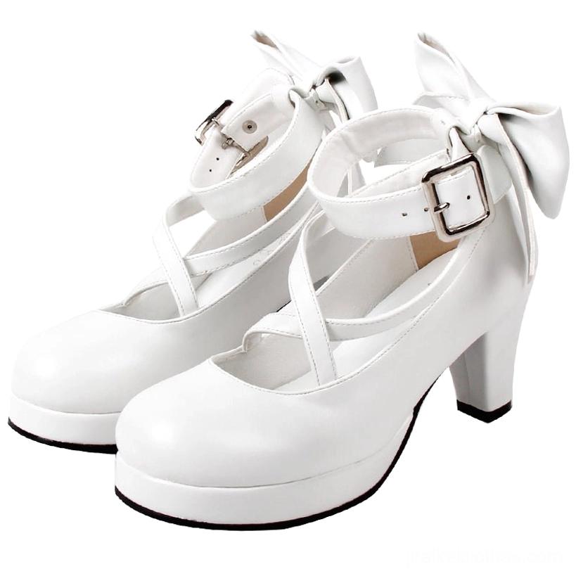 Jirai Kei white patent leather Mary Jane platform heels with round toe cross ankle strap and back bow detail front three-quarter view