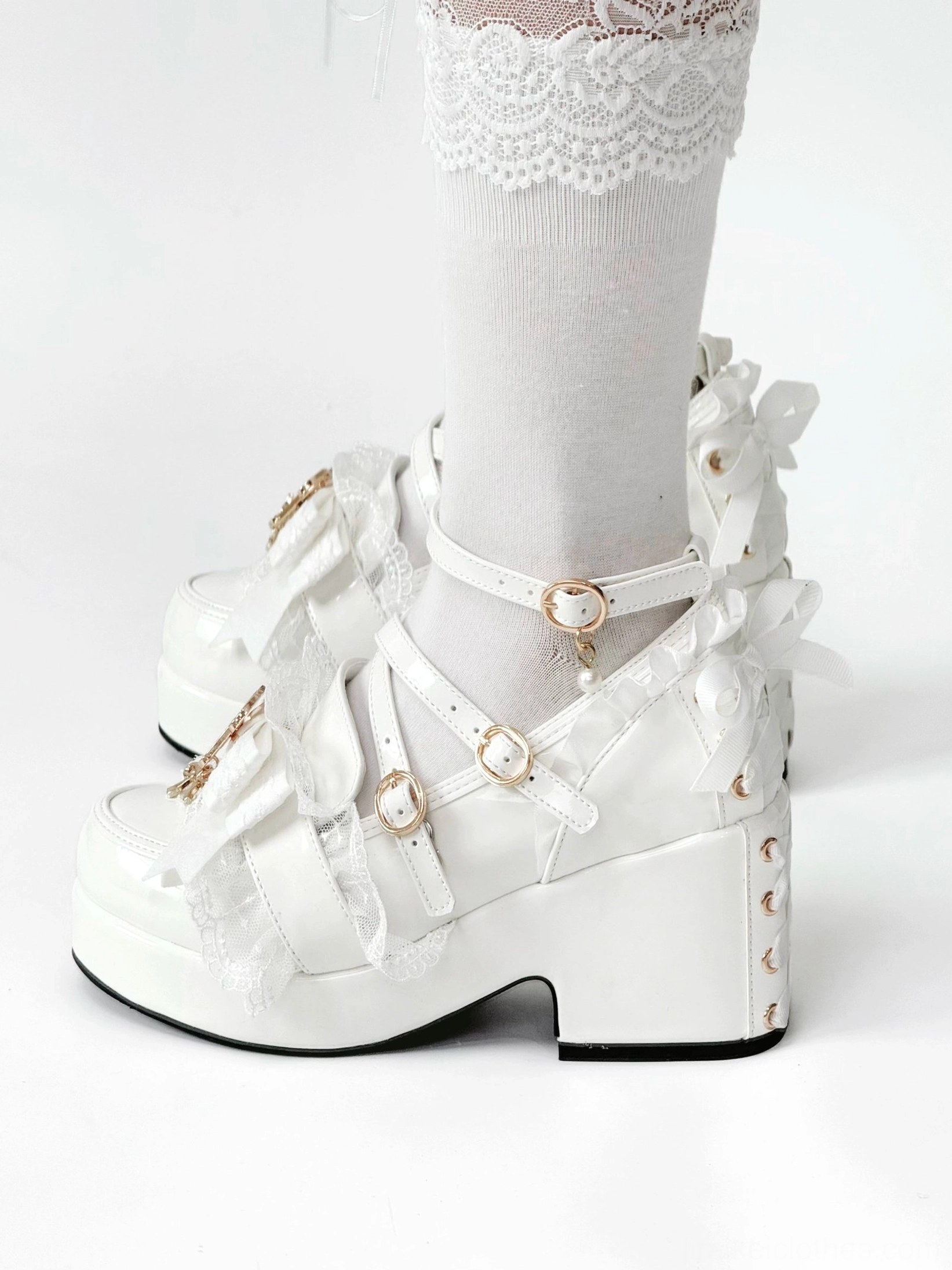 White patent leather Jirai Kei platform heel feet photo shoot showing authentic wear angle walking comfort and visual impact on wearer from observer perspective