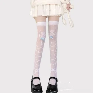 White over-the-knee stockings with light blue bow ornament and delicate lace pattern, worn with white ruffled skirt and black Mary Jane shoes, light gray studio backdrop