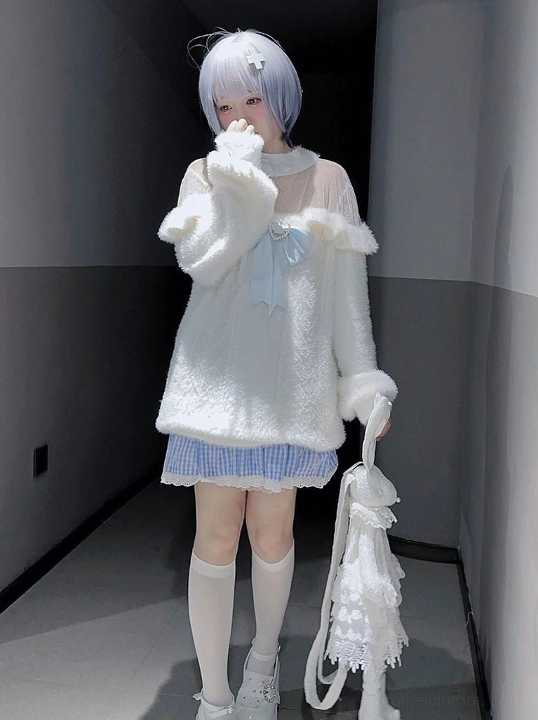 Half-body front standing view of white off-shoulder fuzzy sweater top with knee-high stockings and lace handbag styling