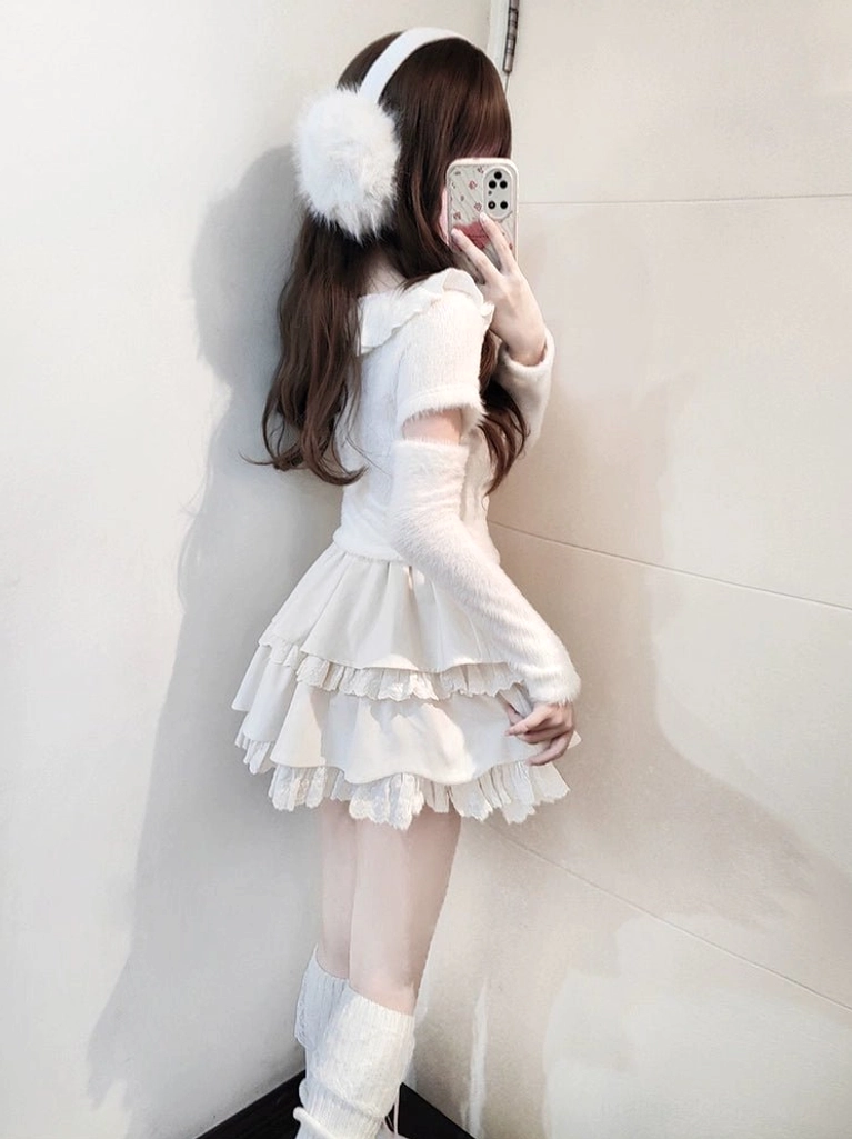 Detailed view of Jirai Kei white sweater featuring V-shaped collar with flounce trim and fuzzy polyester-spandex blend fabric texture, showcasing quality craftsmanship and material