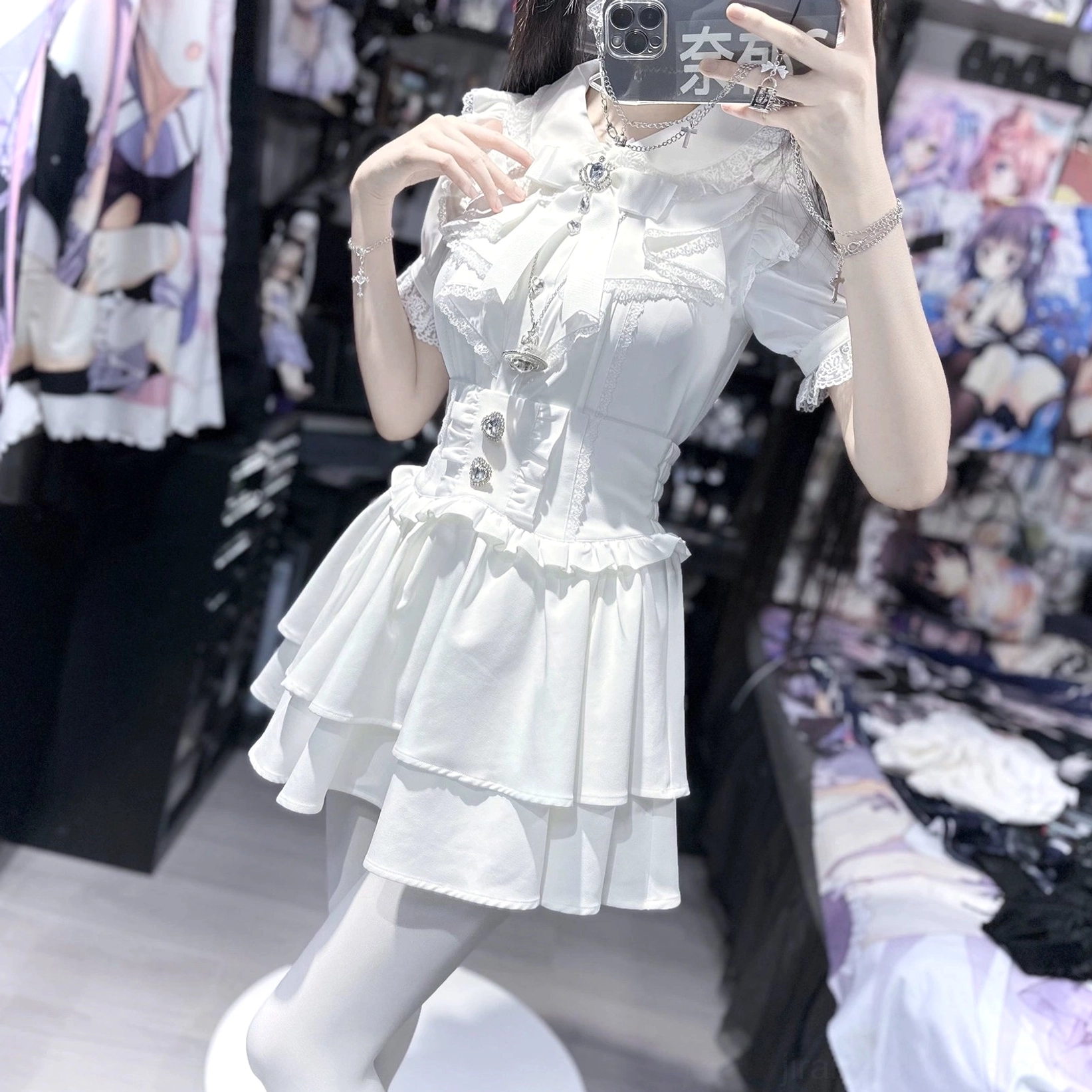 White jirai kei two-piece set full-length front selfie on mannequin, corset-style bodice, ruffled waist trim, sheer white tights, anime boutique