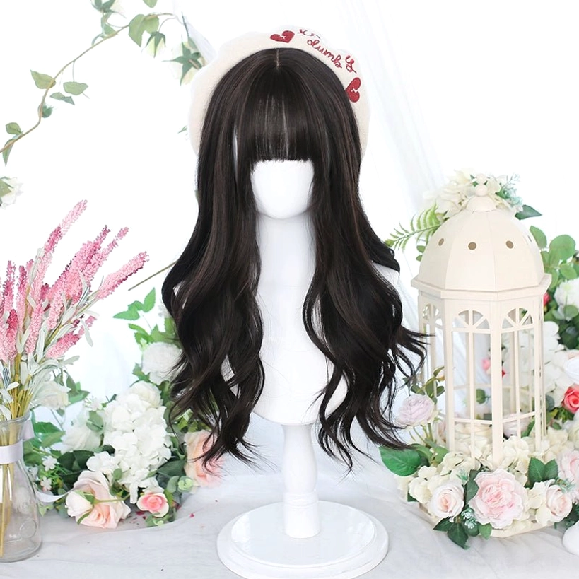 Deep black long curly Jirai Kei wig with beret accessory and neat straight bangs displayed with birdcage flower props