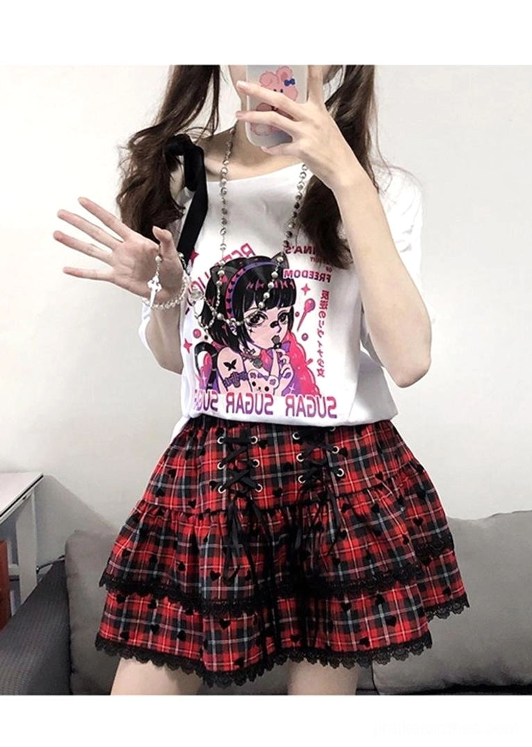 Y2K Jirai Kei off-shoulder anime graphic tee and black plaid skirt two-piece set showcasing cold-shoulder design, ruffle construction, and lace details