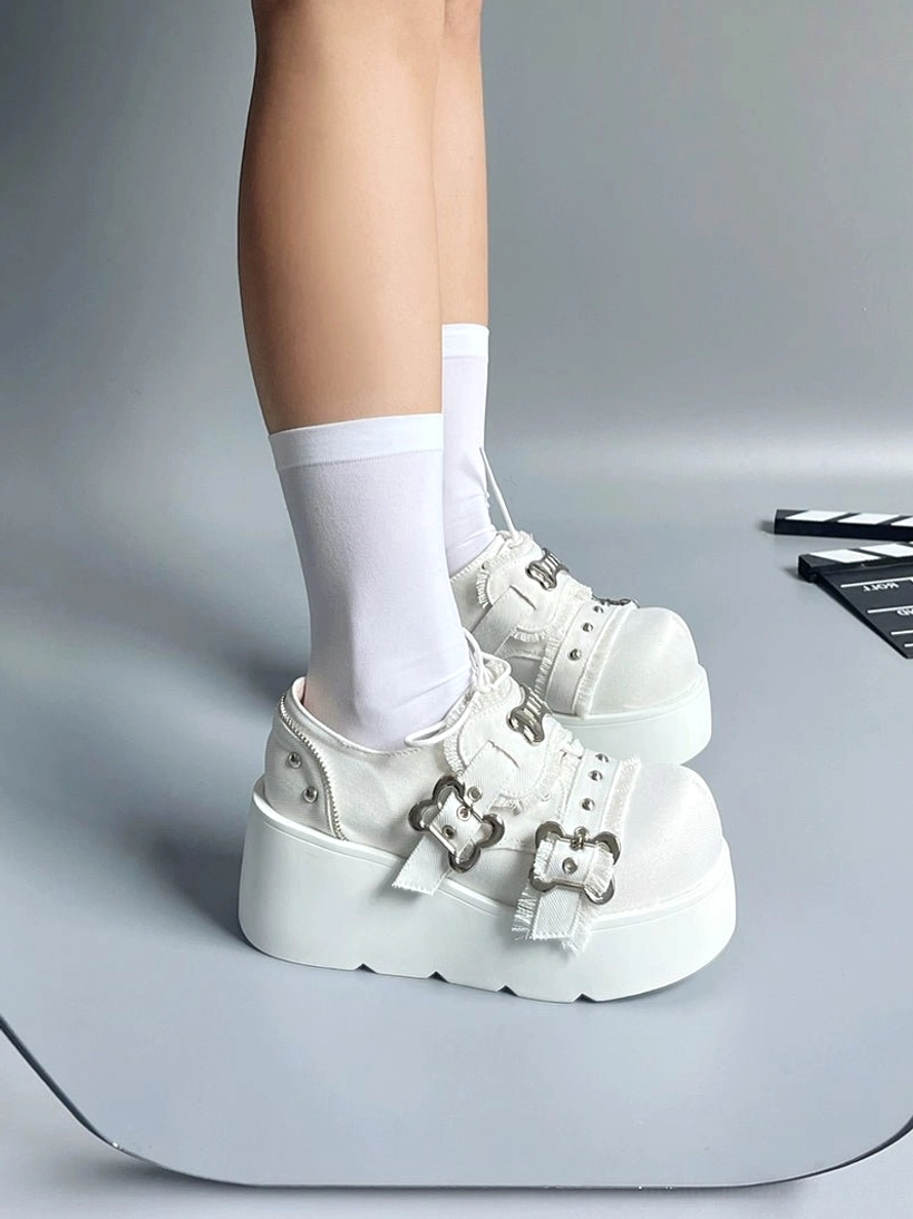 Jirai kei Y2K punk platform slip-on shoes heel detail metal zipper bone buckle embellishments close-up view