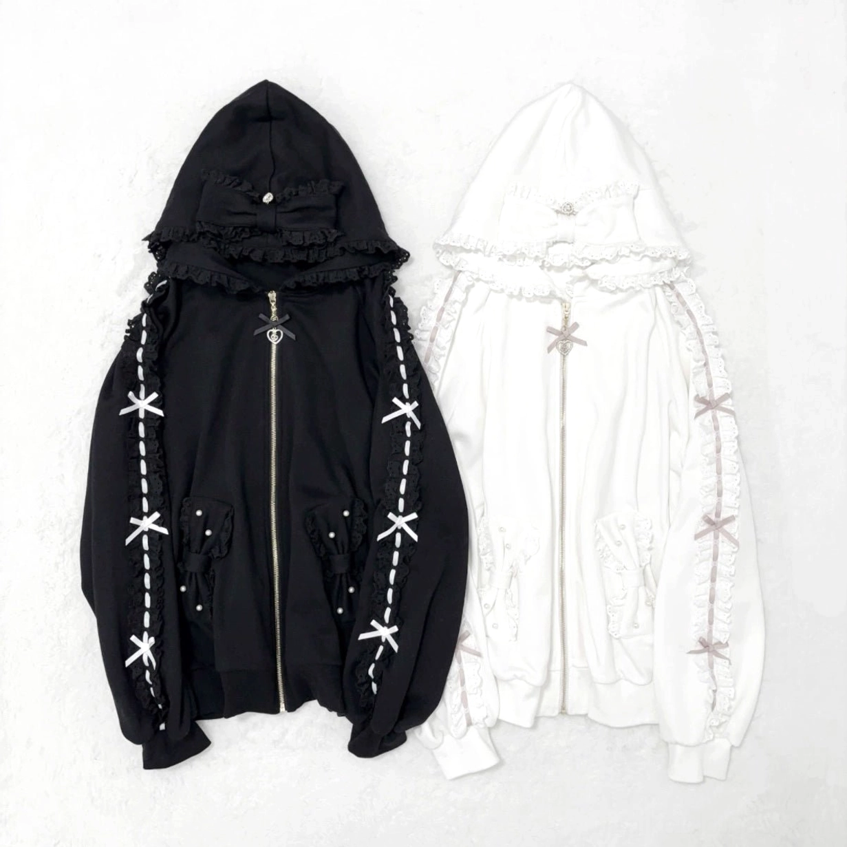 Jirai Kei fleece-lined zip-up hoodie available in black and white, showing color variation options with ruffled hood and decorative pearl bow accents