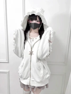 White Jirai Kei zip-up hoodie front upper body portrait, featuring frilled ruffle hood, lace bow sleeve trim details, and bow-adorned zipper pull accent