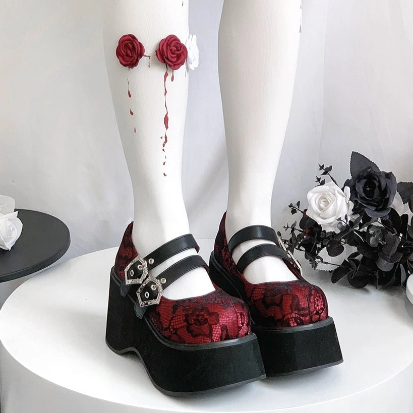 Lace red Mary Jane platform shoes showing bold crimson color with delicate lace texture dual silver buckles and thick platform sole