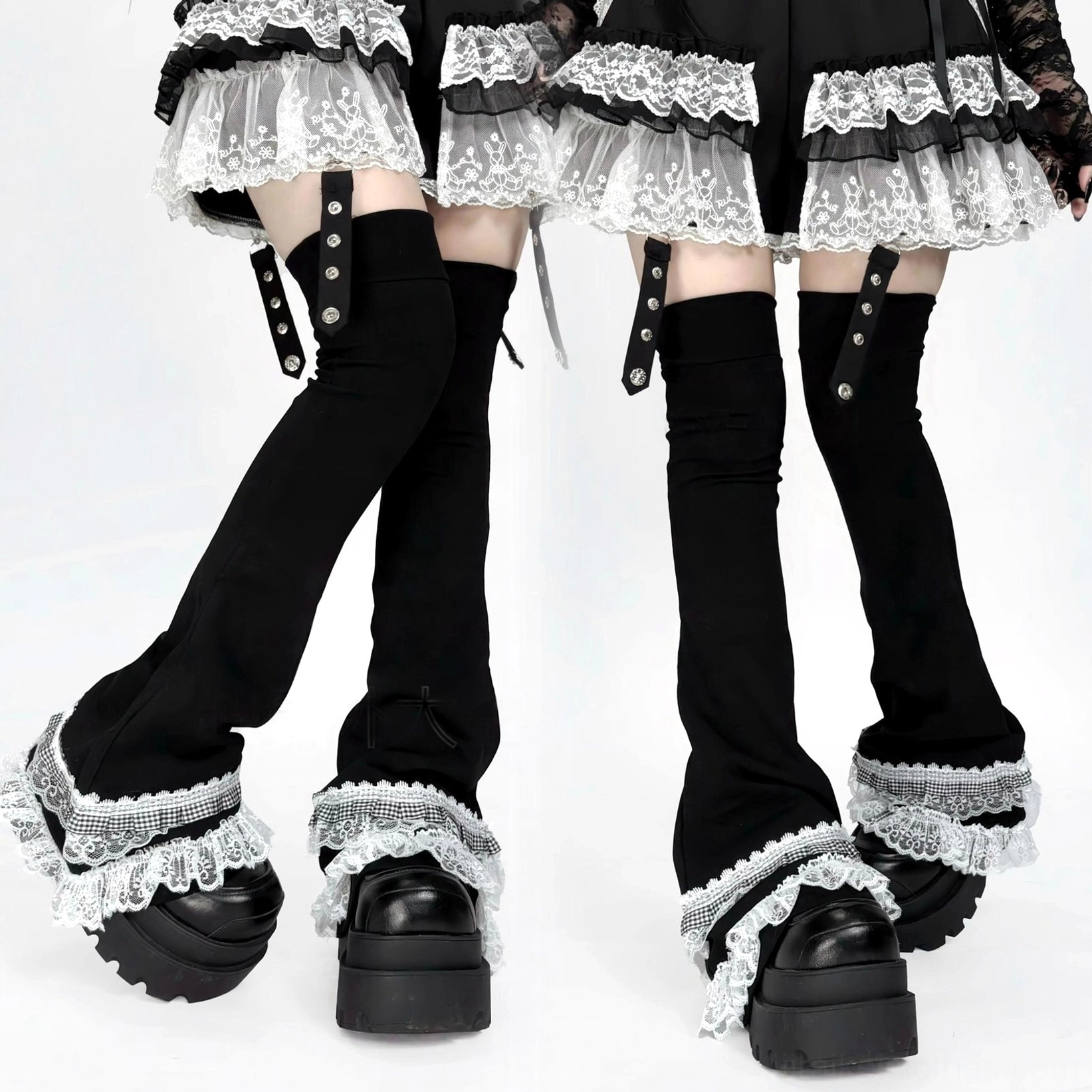 Multiple leg pairs showing white lace-trimmed over-the-knee leg warmers with black flared covers and adjustable thigh straps detail