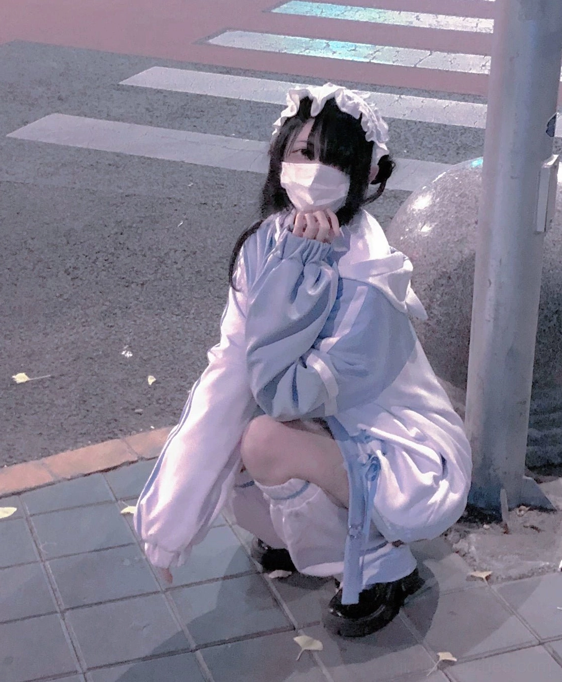 Lavender-white color block Tenshi Kaiwai sport hoodie ensemble with oversized fit, contrast panels, and matching leg warmers on squatting model outdoors