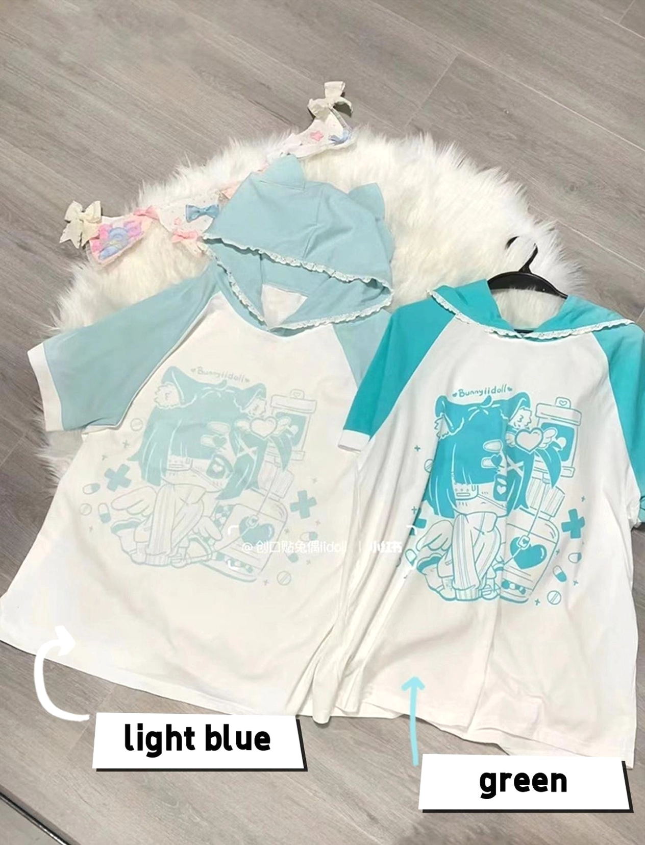 Light blue cyan yami kawaii cat ear hooded anime graphic tee with lace-trimmed hood and loose fit, versatile subculture hoodie top for jirai kei and yami kawaii fashion enthusiasts