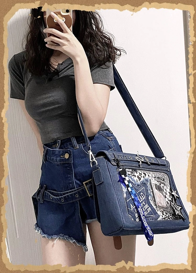 Light blue denim itabag crossbody bag full front display showing square shape anime sticker decorations clear window and adjustable shoulder strap