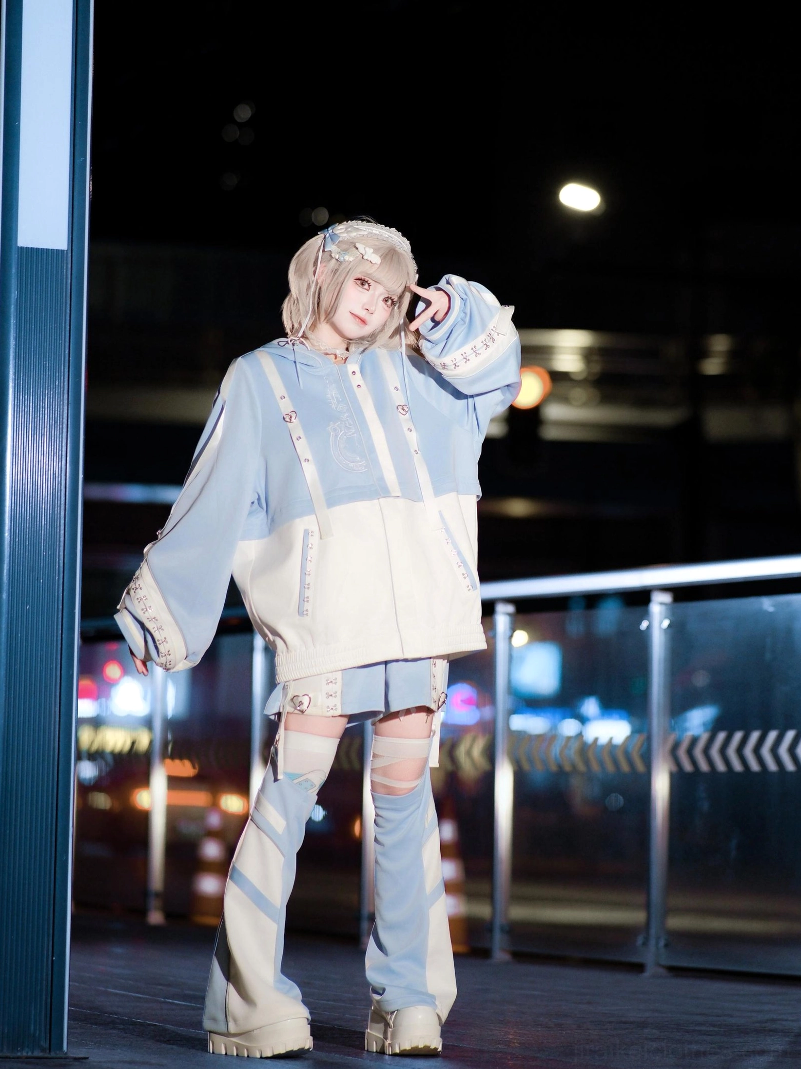 Light blue techwear hoodie set single model front full body night view outdoor overpass cropped hoodie split-style leg warmers