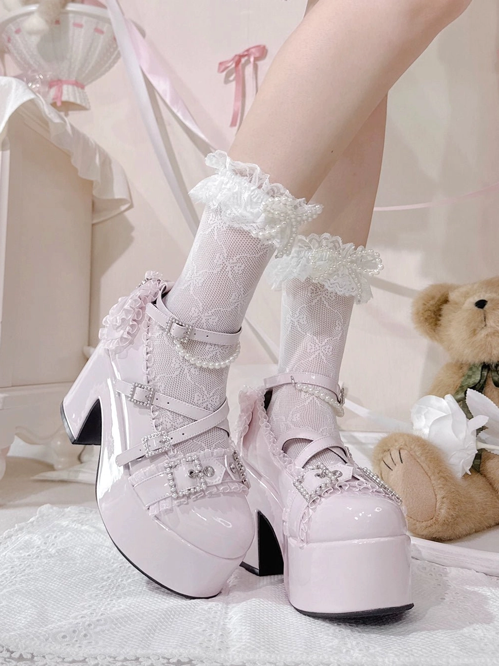 Light pink patent leather Ryousangata platform heels top-down side view with rhinestone decorated straps thick round platform sole paired with frilly socks bedroom scene