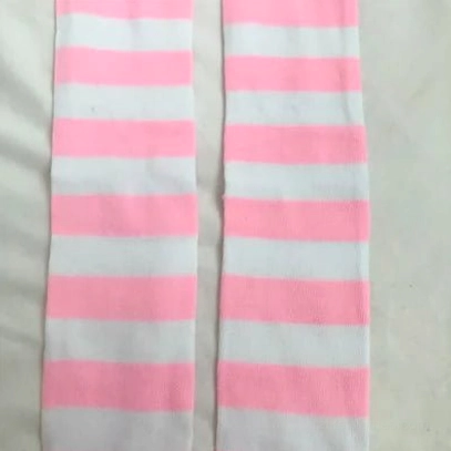 Light pink and white striped over-the-knee socks flat lay top view, soft pastel horizontal stripes, white background