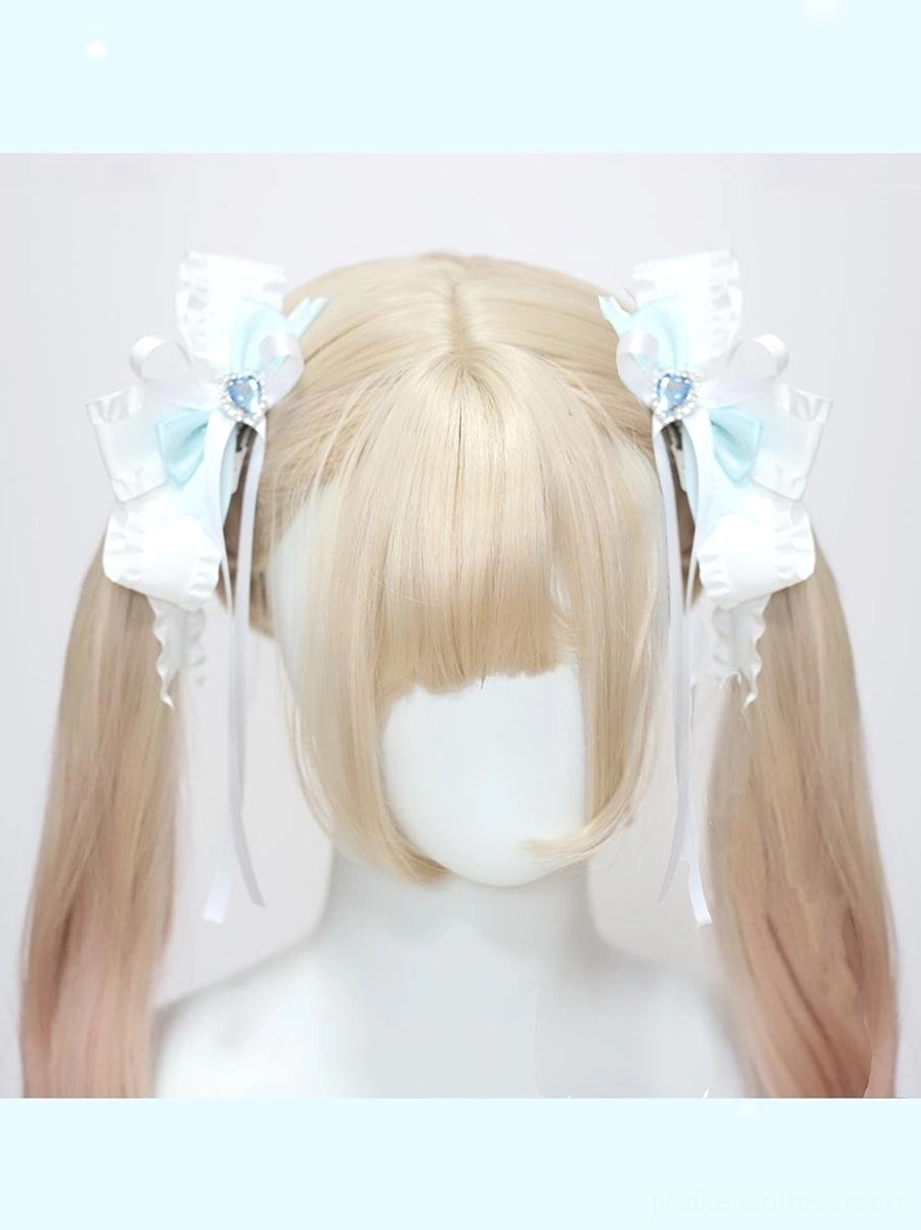 Lolita jirai kei butterfly hair clips three-quarter angle view on ombre blonde ponytails with blue-white ribbon design and gemstone center