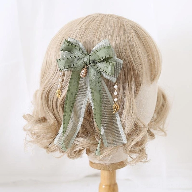 Matcha green Jirai Kei decorative brooch featuring intricate lace detailing, pearl and metallic accents, perfect for pinning to clothing or accessories in romantic alternative fashion