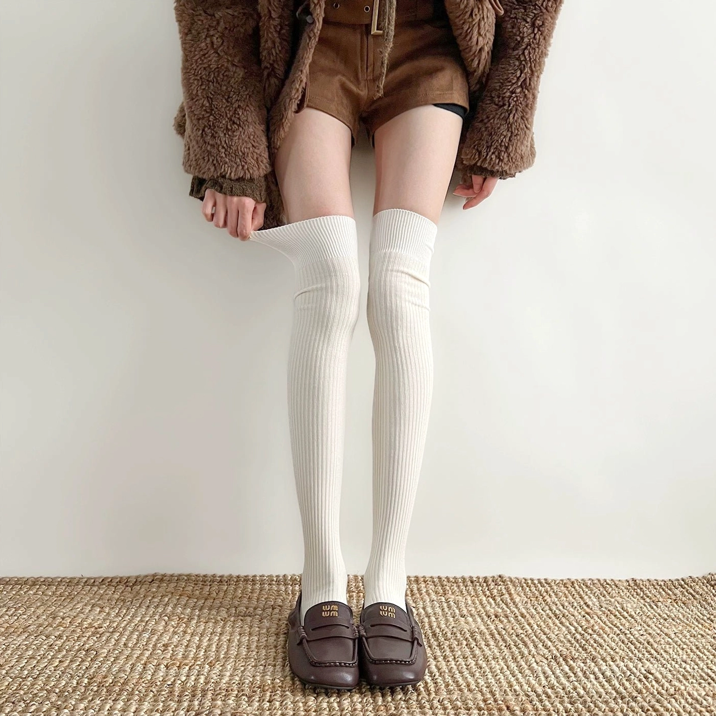 Cream white over-the-knee ribbed socks Jirai Kei worn with loafers fuzzy coat woven rug studio