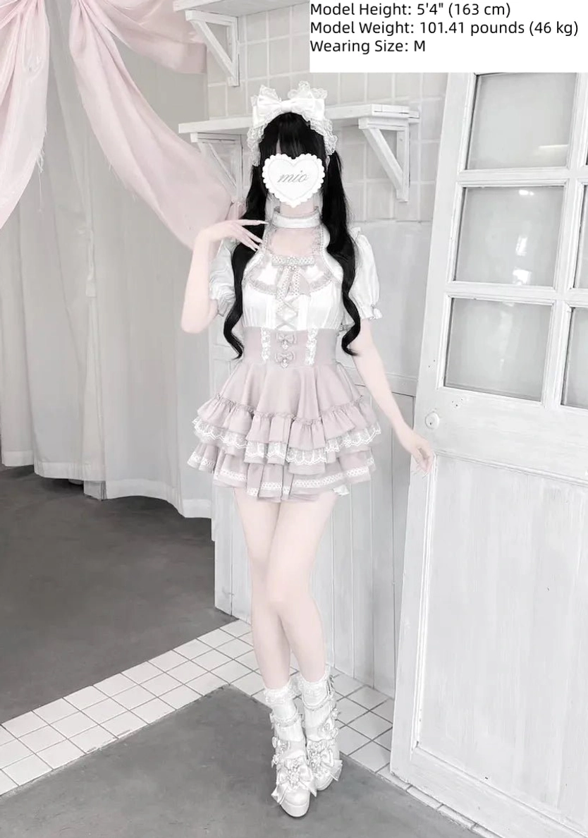 Full body front view model wearing pastel pink Jirai Kei heart lace blouse tiered skirt set with cat ear hairclip and white boots