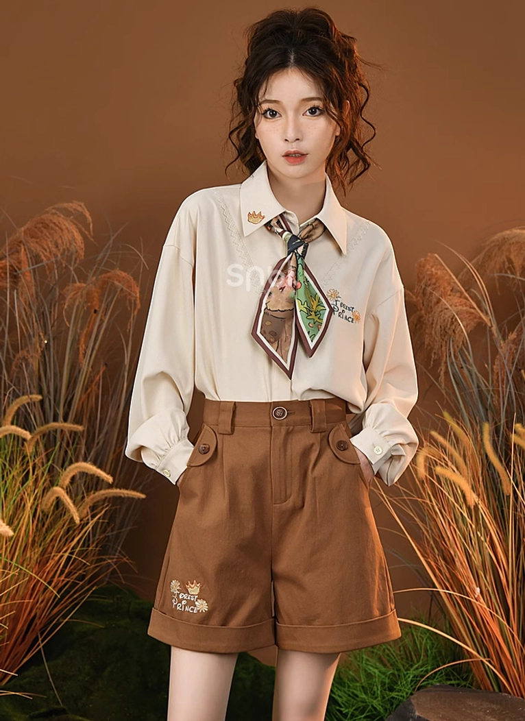 Brown mori kei shorts standalone view highlighting embroidered accents and tailored fit construction