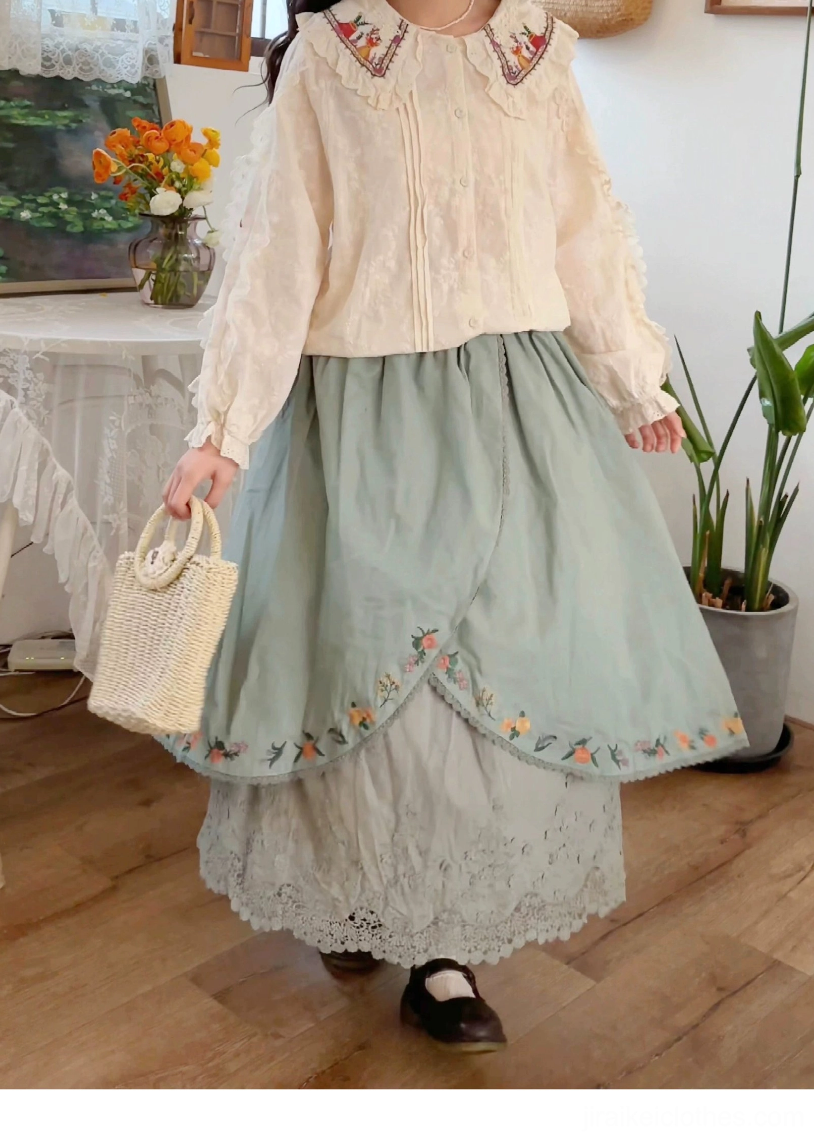 Mori style embroidered skirt dusty blue with scalloped embroidery trim and crocheted tote bag front half body view